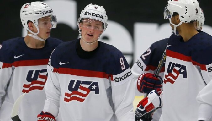 Jack Eichel (№9) celebrates with Mike Reilly (L) and Seth Jones scoring a goal against Slovenia