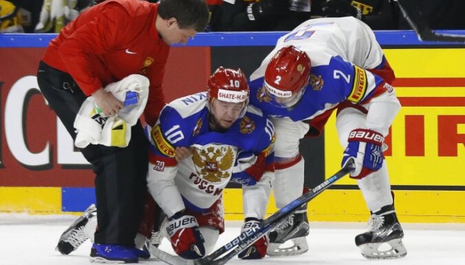 Sergei Mozyakin of Russia sustains an injury