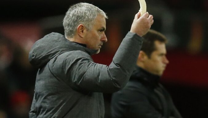 MU manager Jose Mourinho holds a banana
