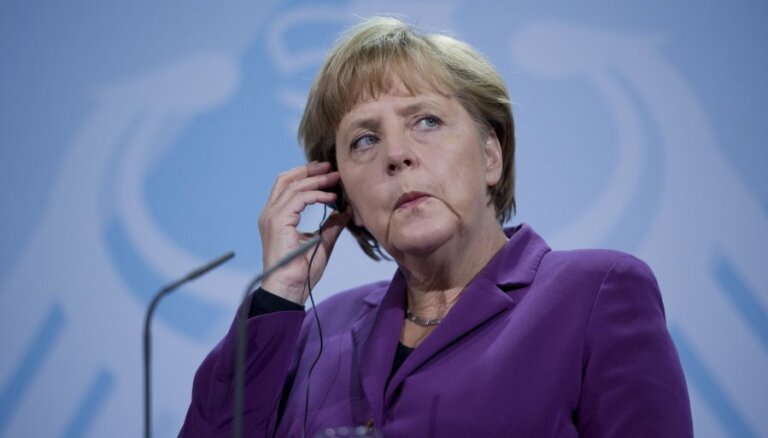 Меркель не намерена отвечать за долги Испании и Италии